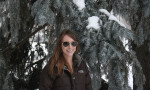 Blog author Dylan standing in front of a pine tree