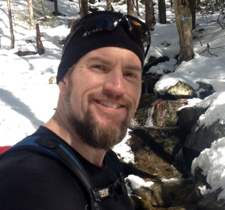 Steve headshot out in the wilderness; snow on the ground