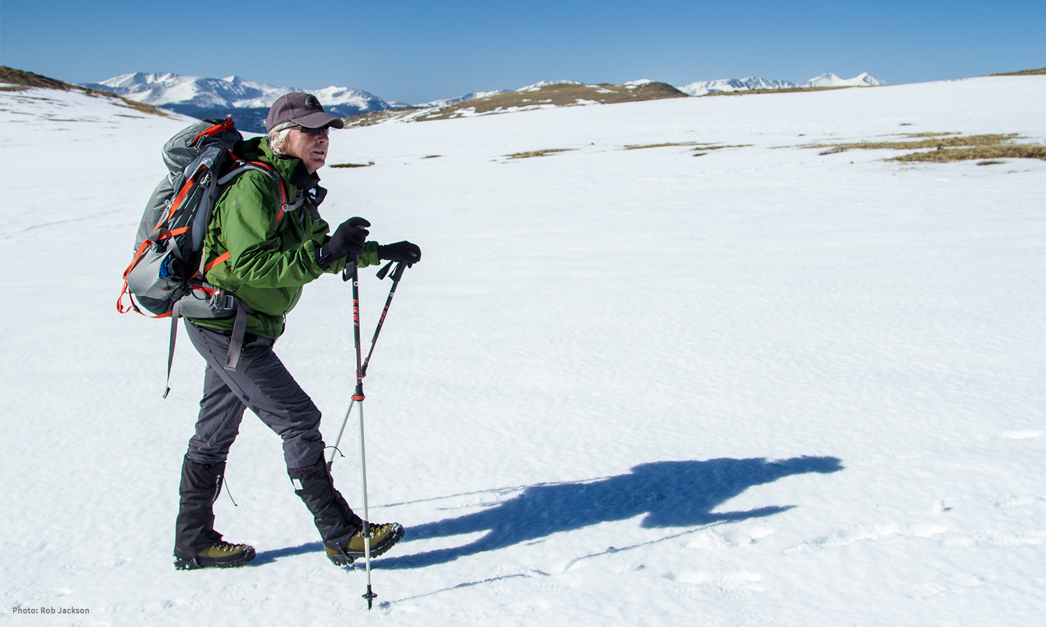 Image of Diggs using his climbing poles to walk through the snow