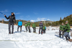 Leader Jeff Evans working with members of the team atop St. Mary's Glacier. Photo Credit: Rob Jackson