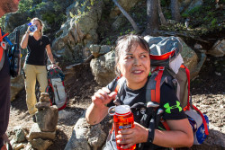 Team member Xiaolian and team guide Margaux take a minute to stay hydrated 