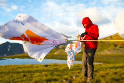 Expedition Leader Charley Mace setting up the flags at basecamp